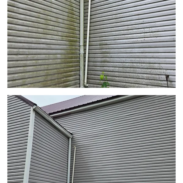 Before and after: green streaks cleaned from the corner walls of a grey metal building